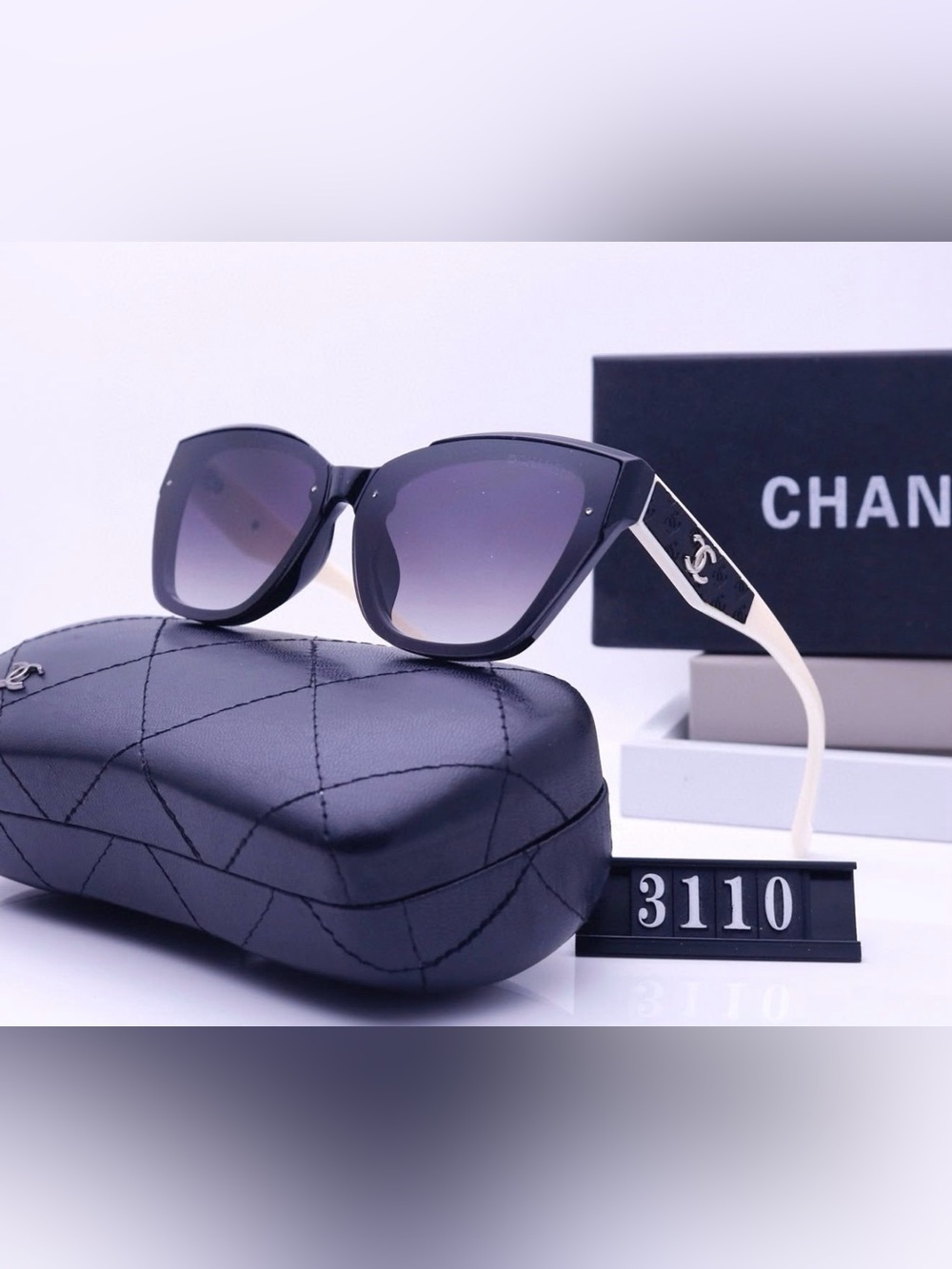 CHANEL Black Frame Sunglasses with Gradient Lenses and Cream Temples